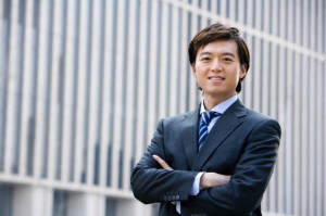 Confident businessman standing in front of downtown building