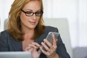 Business woman using cell phone