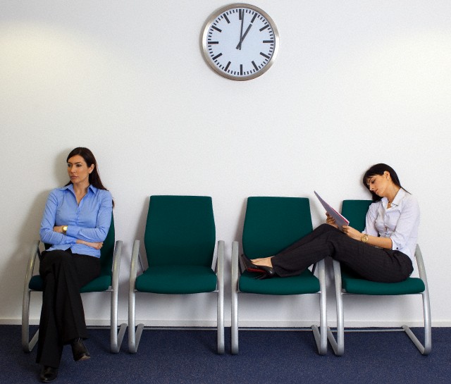 Two businesswomen sitting in waiting room