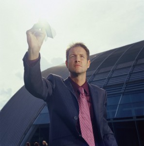 Businessman Holding Paper Airplane